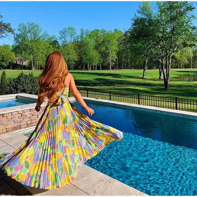 Bedrucktes Sommerkleid mit tiefem Ausschnitt und Schleifendetail – Vivienne